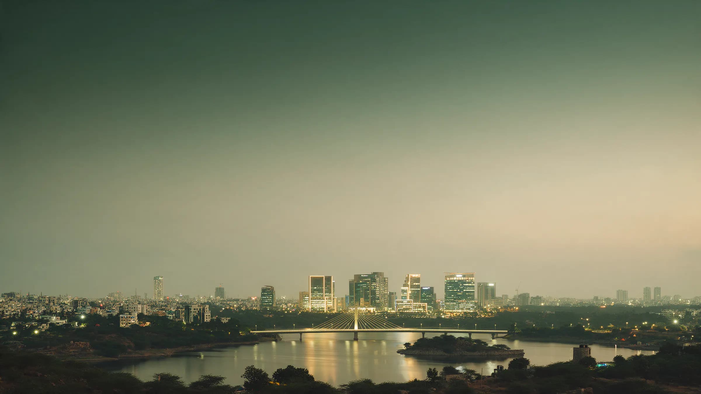 Durgam Cheruvu cable bridge and the HITEC City skyline at blue hour